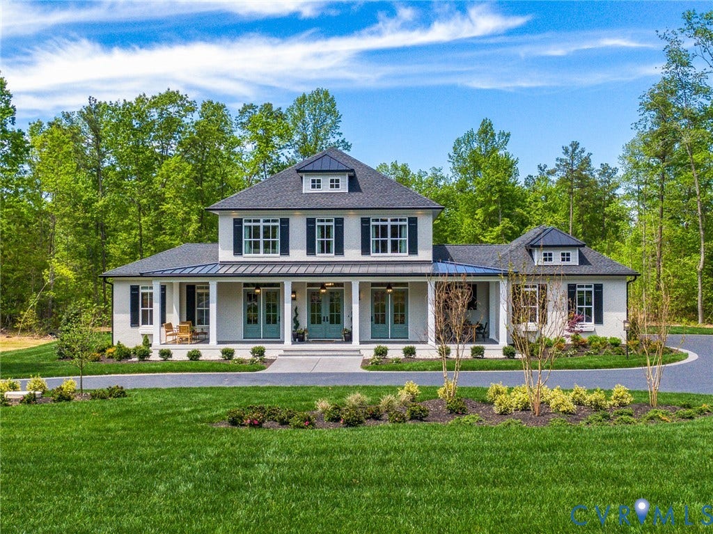 18128 Dogwood Trail Way, Rockville, VA 23146 Two-story painted brick exterior featuring a covered front porch, metal roof accents, dormer windows, and dark-finished shutters