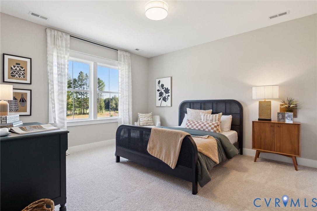 18128 Dogwood Trail Way, Rockville, VA 23146 Neutral-toned interior space featuring wall-to-wall carpeting, a multi-pane window with exterior greenery, and a centrally mounted flush-mount light fixture