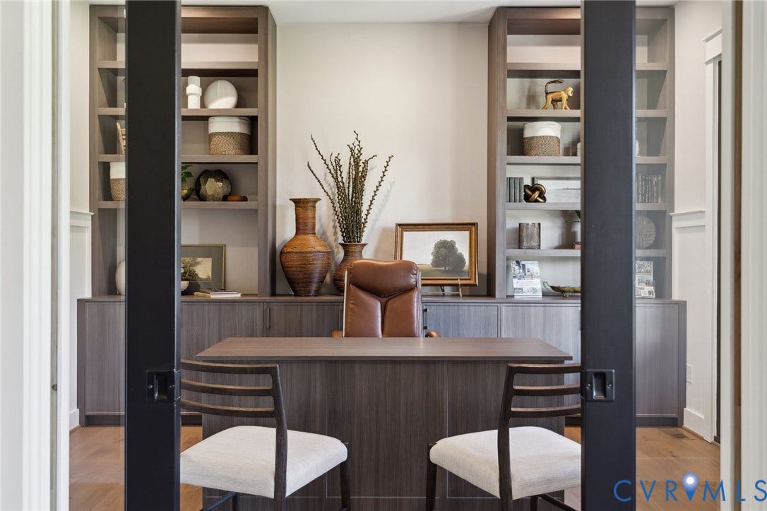 18128 Dogwood Trail Way, Rockville, VA 23146 Custom floor-to-ceiling cabinetry with open shelving, dark wood-finish desk, and black-framed sliding glass doors