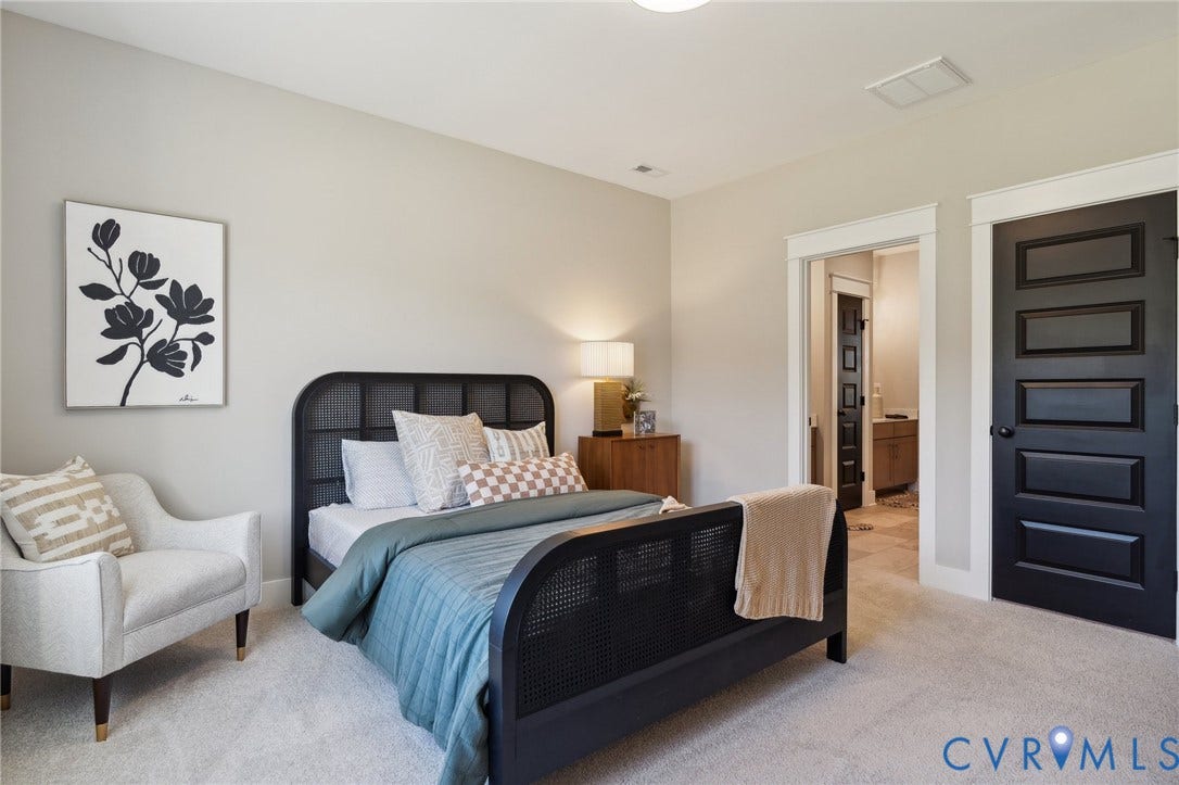 18128 Dogwood Trail Way, Rockville, VA 23146 Neutral-toned interior featuring high ceilings, wall-to-wall carpeting, and contrasting dark-finished interior doors with decorative trim