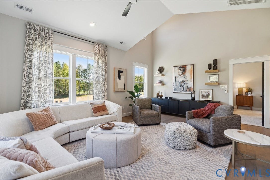18128 Dogwood Trail Way, Rockville, VA 23146 Vaulted ceilings, large-format windows, wood-finish flooring, and wall-mounted floating shelving