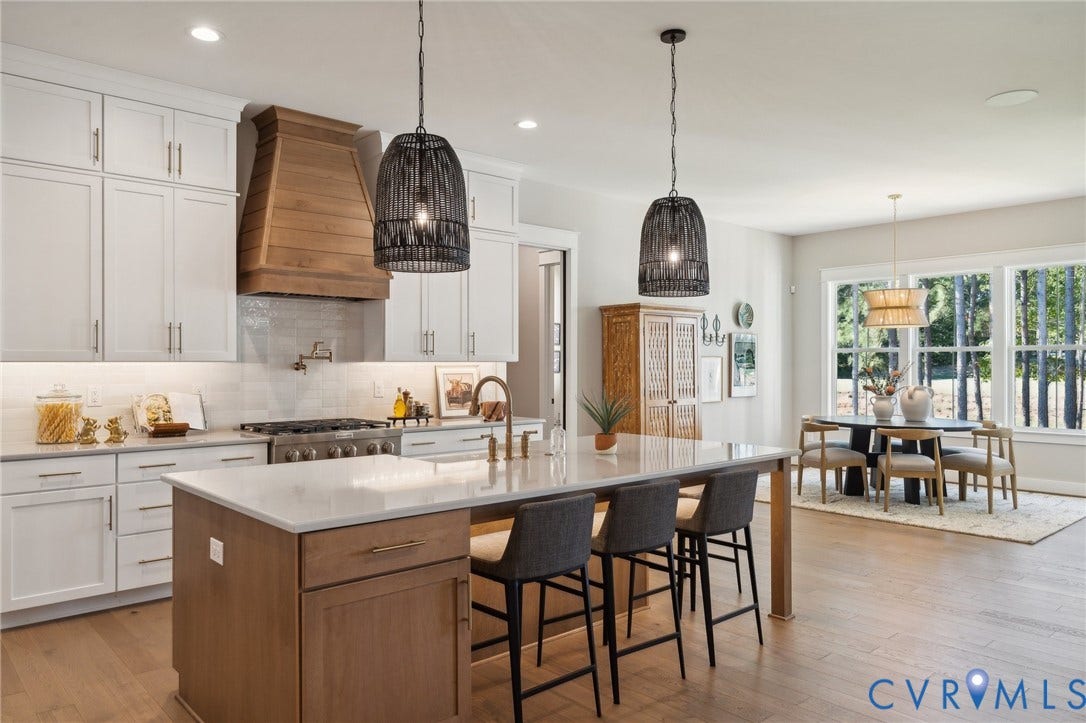 18128 Dogwood Trail Way, Rockville, VA 23146 Kitchen featuring white shaker-style cabinetry, quartz countertops, a wood-finish central island, a custom wood range hood, and pendant lighting