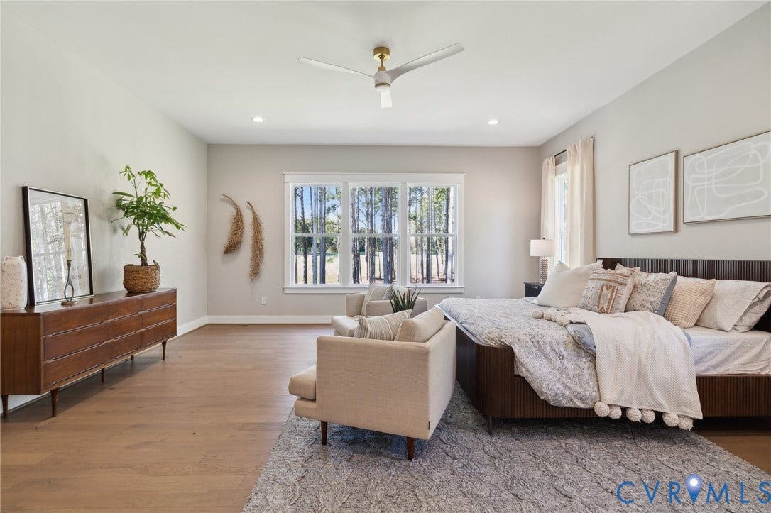 18128 Dogwood Trail Way, Rockville, VA 23146 Spacious room featuring wood-finish flooring, recessed lighting, a modern ceiling fan, and large windows with exterior surroundings