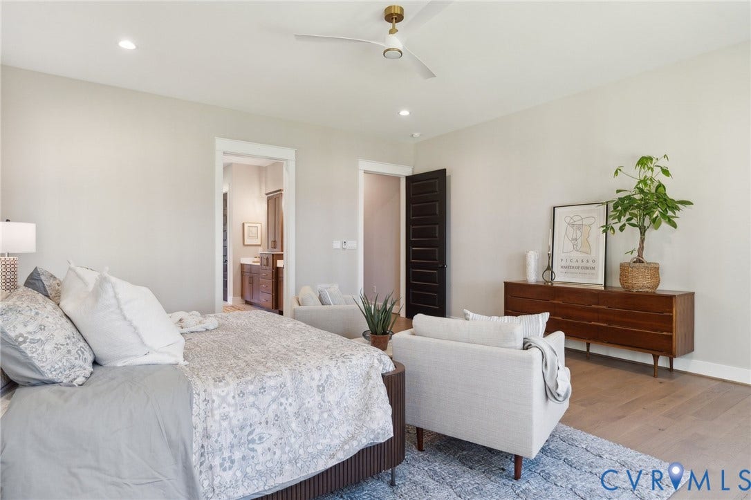 18128 Dogwood Trail Way, Rockville, VA 23146 Spacious room featuring wood-finish flooring, recessed lighting, a modern ceiling fan, and a solid-core dark wood door