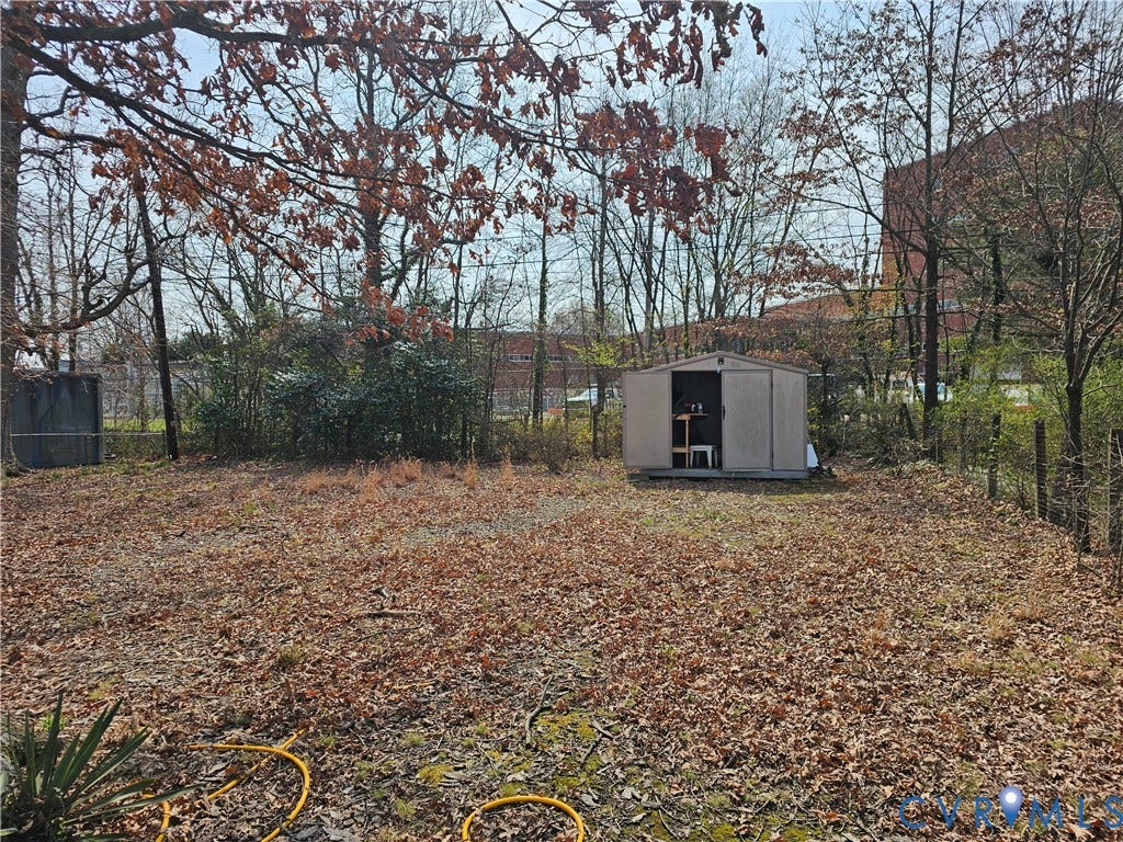 3455 McGuire Drive, McGuire Homes, Richmond, VA 23224 Expansive lot featuring mature trees and a detached storage structure