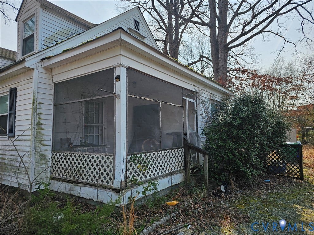 3455 McGuire Drive, McGuire Homes, Richmond, VA 23224 Exterior featuring a screened-in porch with lattice skirting and white lap siding