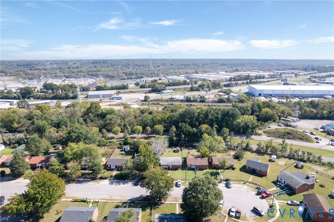 2108 Ridgemont Road, Richmond, VA 23224 Aerial perspective of a residential street featuring single-story dwellings with shingled roofing and established perimeter trees