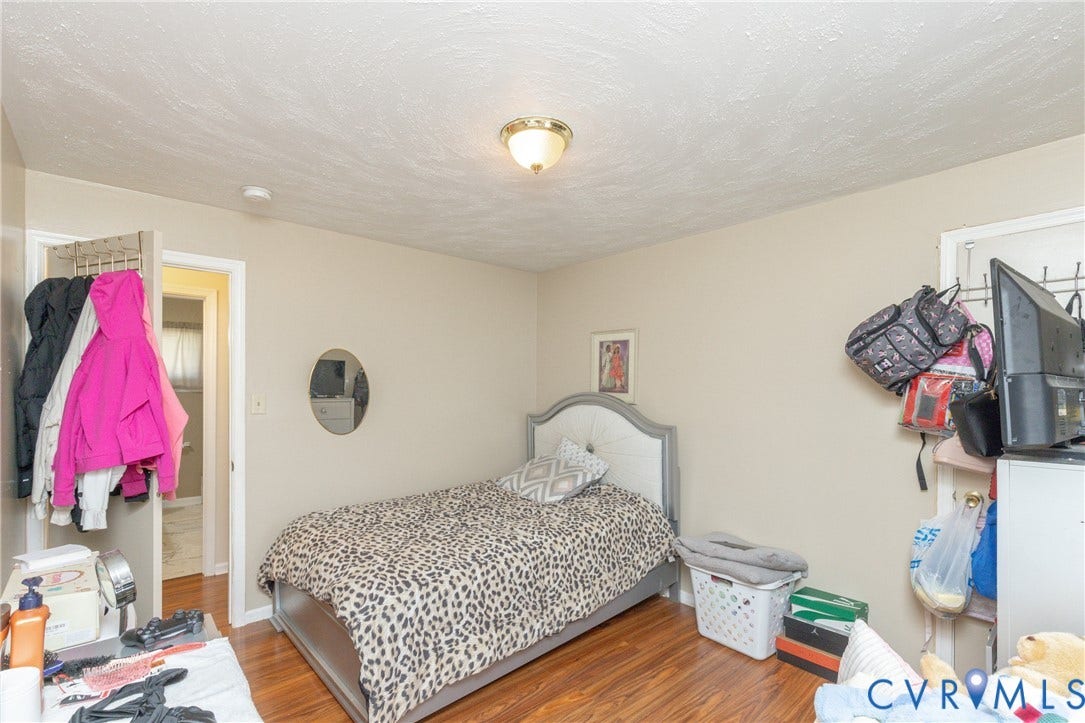 2108 Ridgemont Road, Richmond, VA 23224 Wood-finish flooring and center flush-mount light fixture