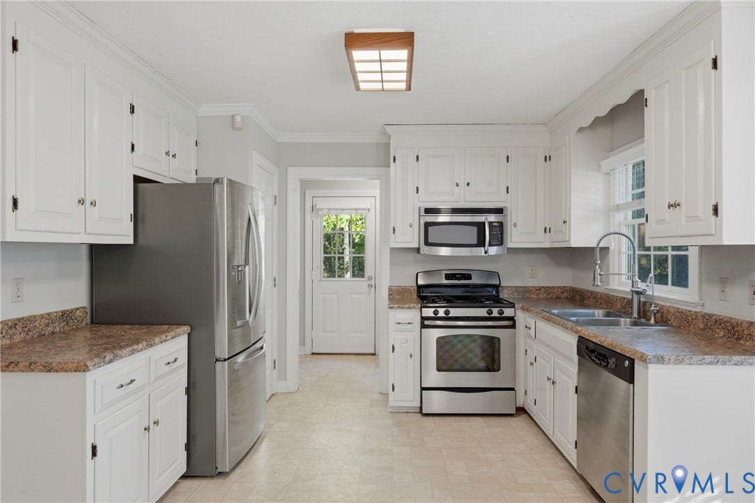 7270 Crossing Oaks Trail, Mechanicsville, VA 23111 Kitchen featuring white shaker-style cabinetry, stainless steel appliances, stone-patterned countertops, a stainless steel sink with a high-arch faucet, and a flush-mount wooden frame ceiling light