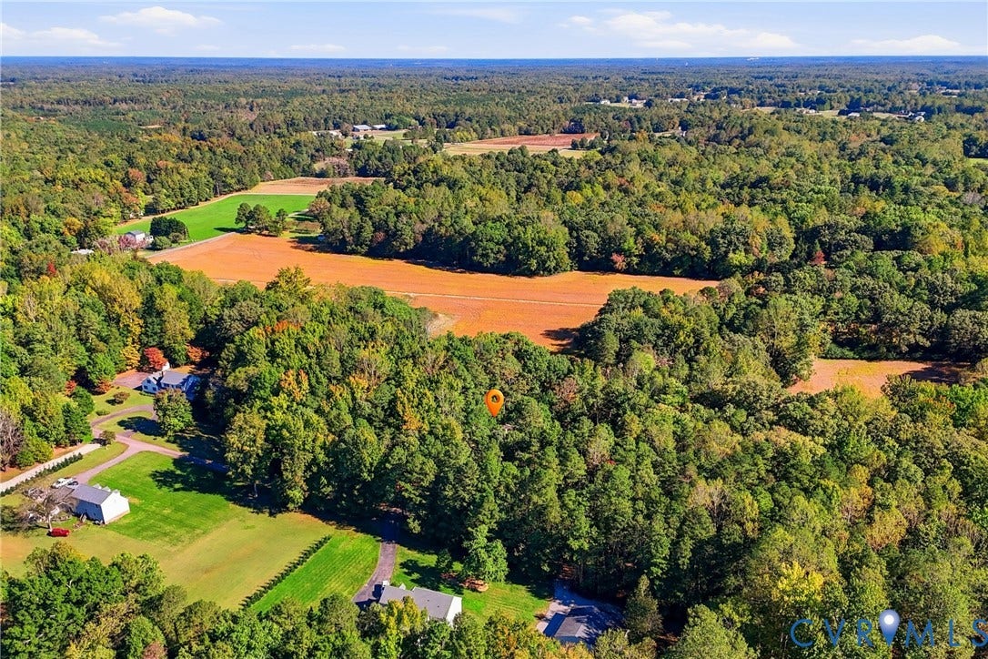 7270 Crossing Oaks Trail, Mechanicsville, VA 23111 Expansive acreage featuring mature woodlands, cleared open fields, and established green space