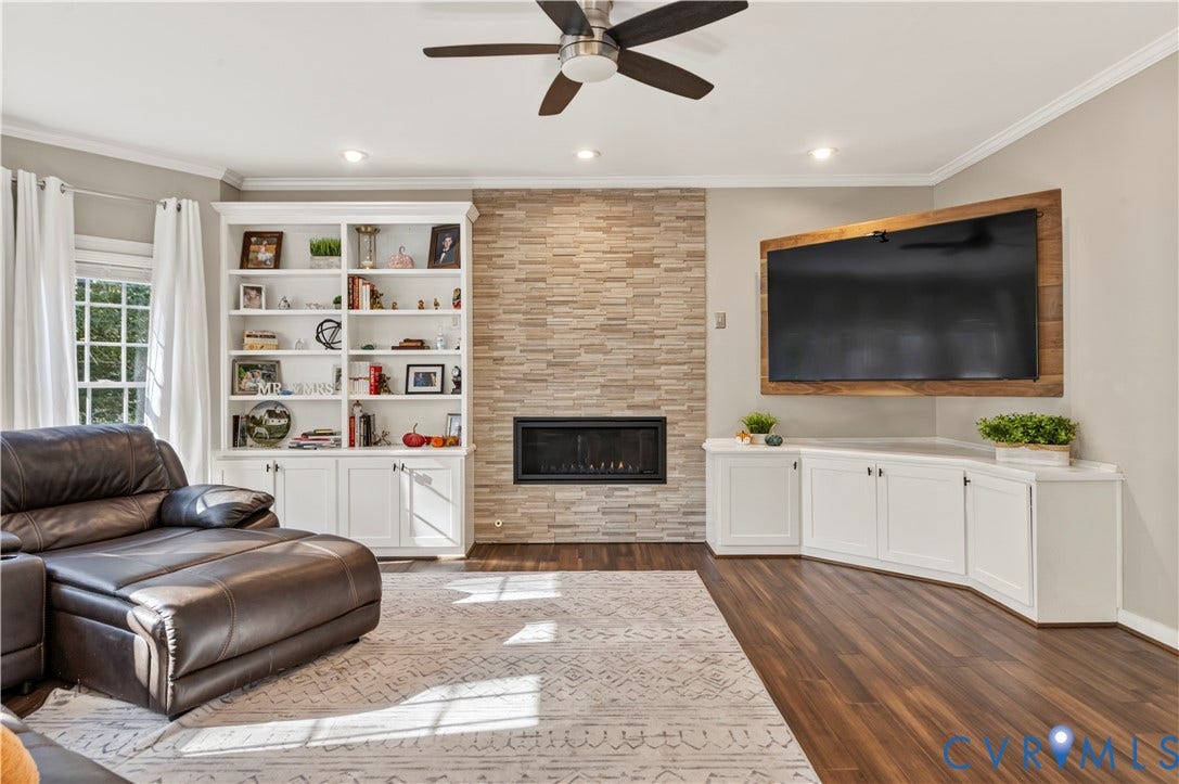 11829 Old School Road, Twin Hickory, Glen Allen, VA 23059 Family room features bamboo floors, recessed lighting, custom built-in wall fireplace and surrounded by custom cabinetry.