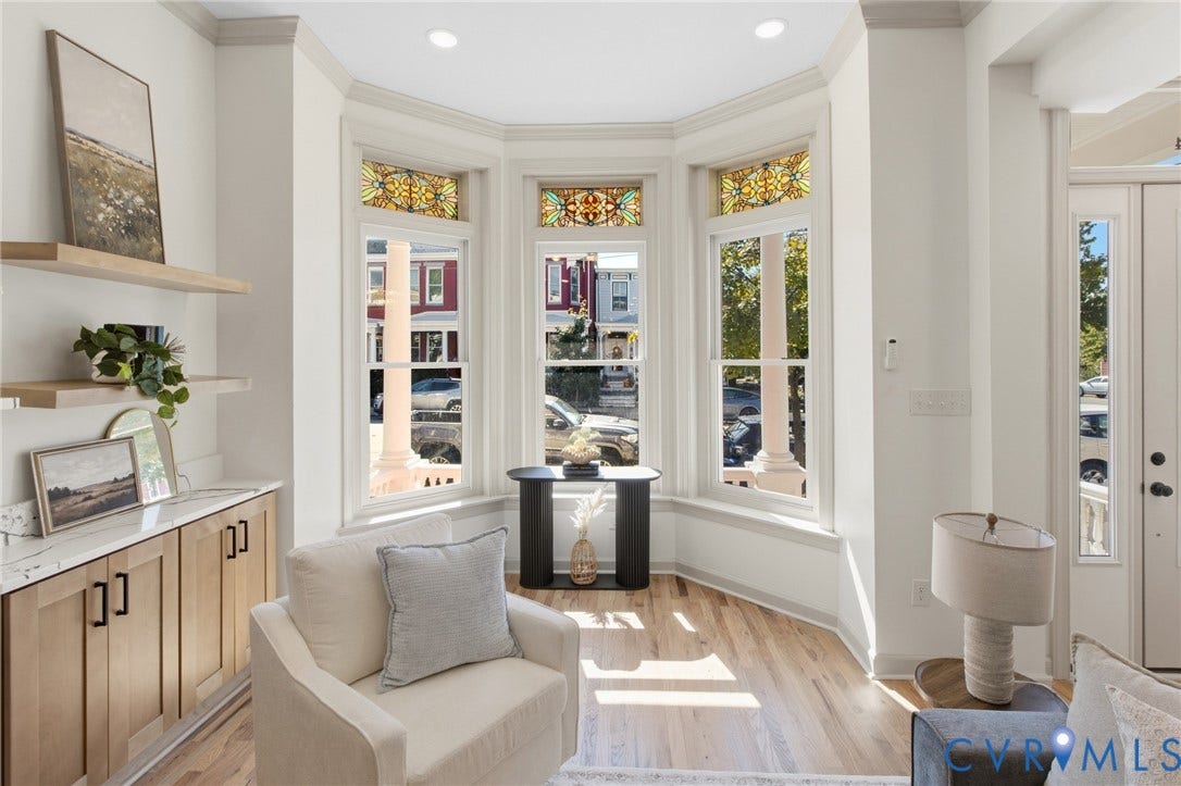 3104 E Broad Street, Richmond, VA 23223 Bay window featuring stained glass transoms, light wood-finish flooring, built-in lower cabinetry with stone-surface countertops, and recessed lighting