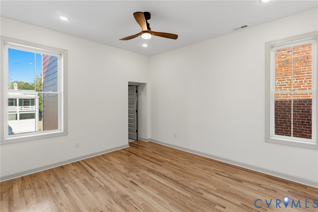 3104 E Broad Street, Richmond, VA 23223 Room featuring wood-finish flooring, recessed lighting, double-hung windows, and a three-blade ceiling fan