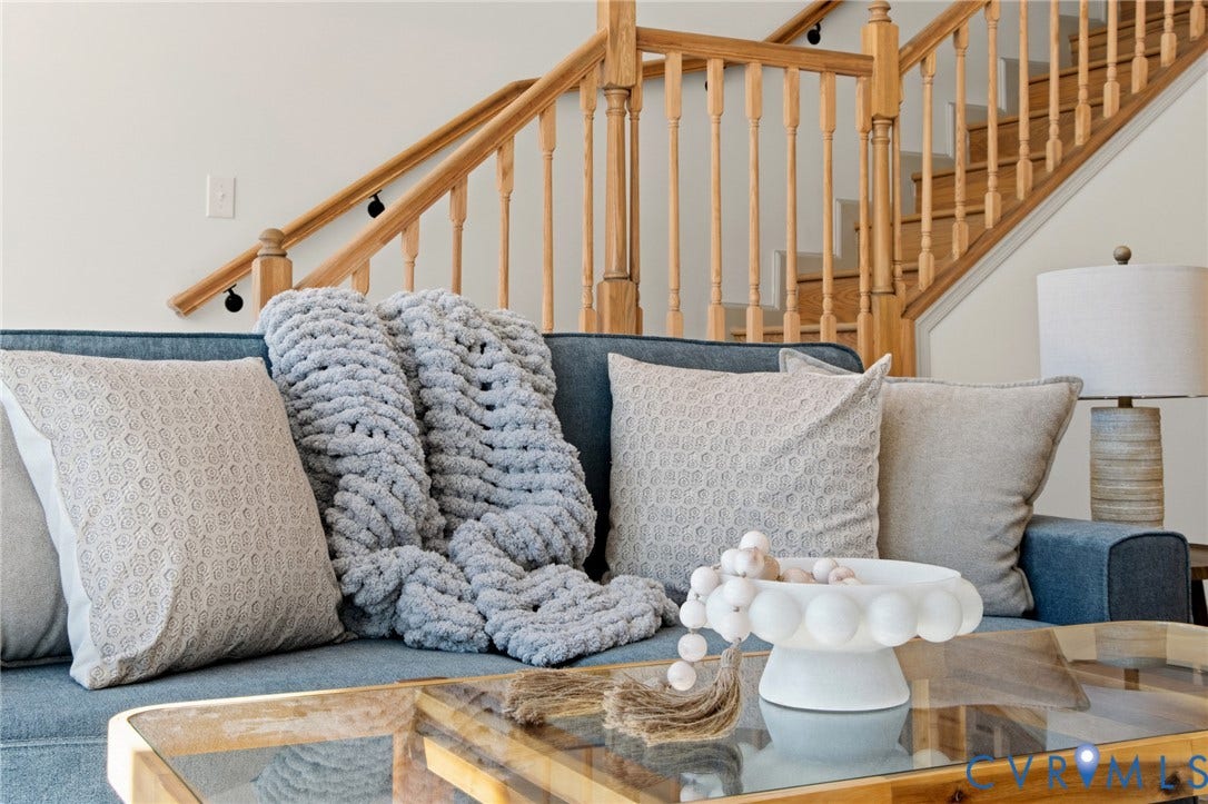 3104 E Broad Street, Richmond, VA 23223 Staircase featuring natural wood handrails and vertical balusters