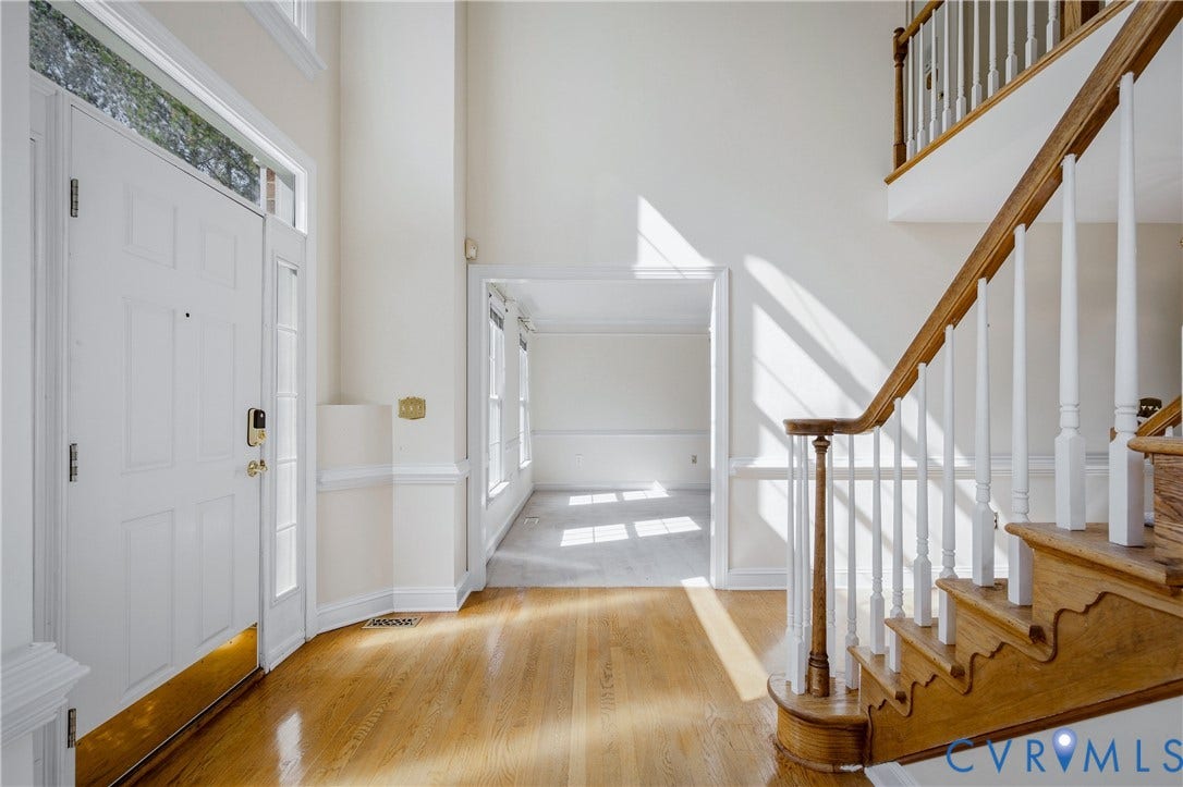 11400 County Drive, Prince George, VA 23842 Foyer featuring high ceilings, wood-finish flooring, a staircase with a wooden handrail