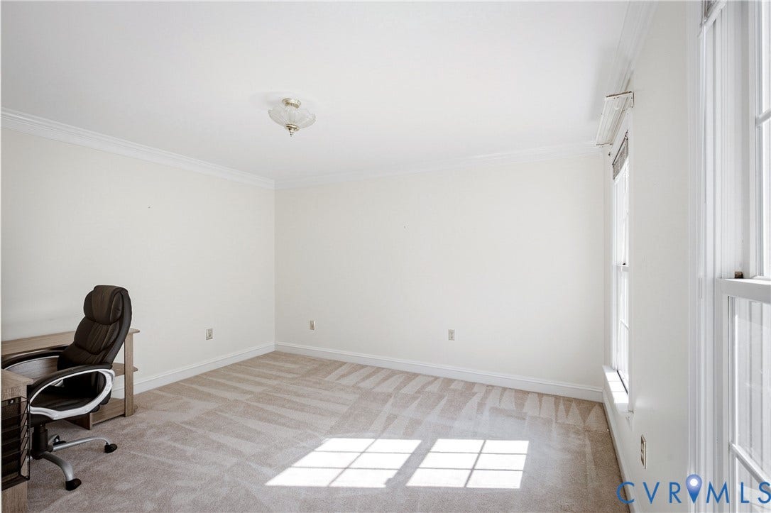 11400 County Drive, Prince George, VA 23842 Neutral interior featuring wall-to-wall carpeting, crown molding, double-pane windows, and a central semi-flush mount light fixture