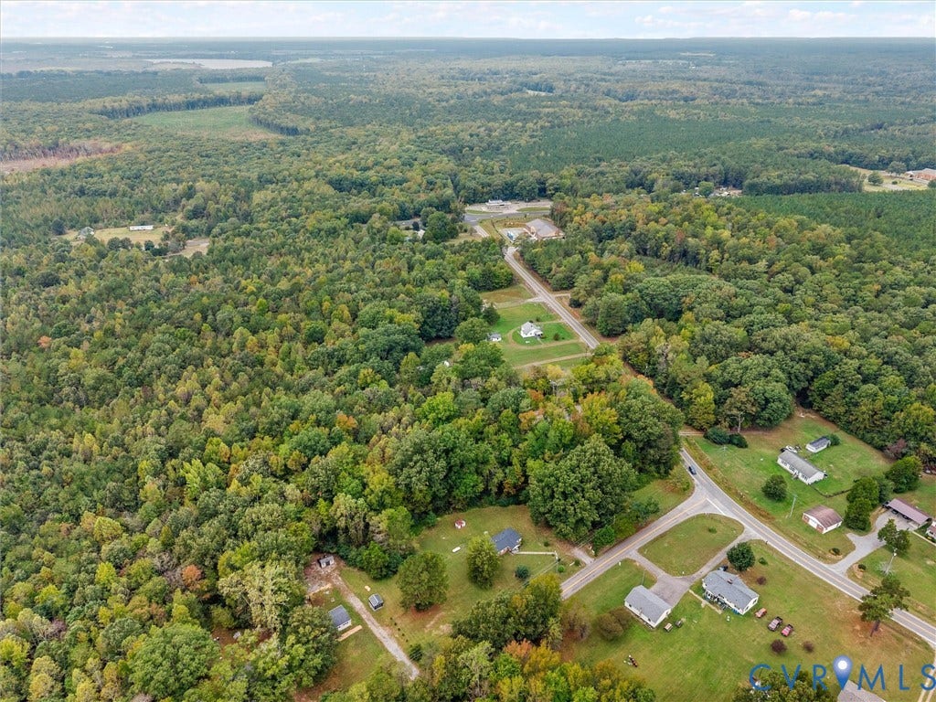 8631 Kimages Road, Charles City, VA 23030 Aerial perspective of an expansive land parcel surrounded by mature woodland and established thoroughfares