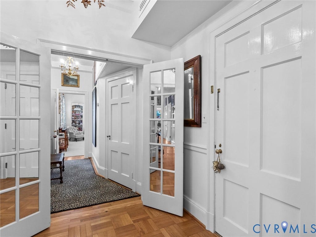 5621 Cary Street Road, #U506, Richmond, VA 23226 Private Primary entrance, Parquet wood-finish flooring, white paneled interior doors, and French-style glass-paneled doors with polished brass hardware