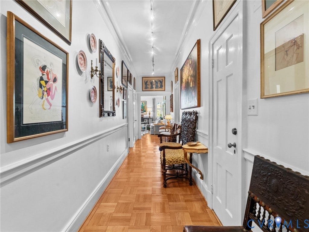 5621 Cary Street Road, #U506, Richmond, VA 23226 Hallway, Parquet wood-finish flooring, decorative chair rail molding, and recessed ceiling track lighting