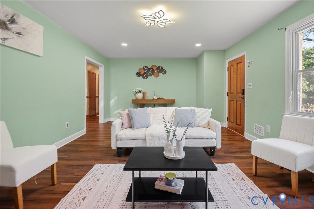 9834 N Wagstaff Circle, Mechanicsville, VA 23236 Wood-finish flooring, decorative petal-style ceiling lighting, recessed lighting, and a six-panel wood door