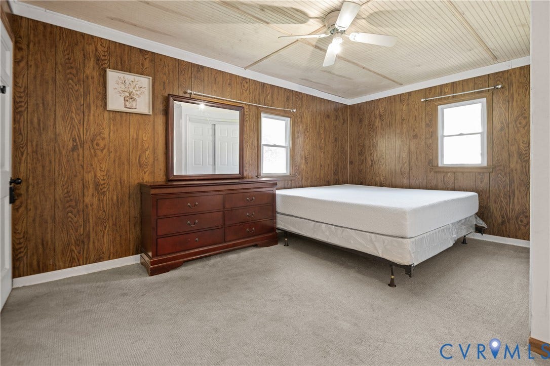 9834 N Wagstaff Circle, Mechanicsville, VA 23236 Wood-panelled walls, tongue-and-groove ceiling, and ceiling fan with integrated lighting