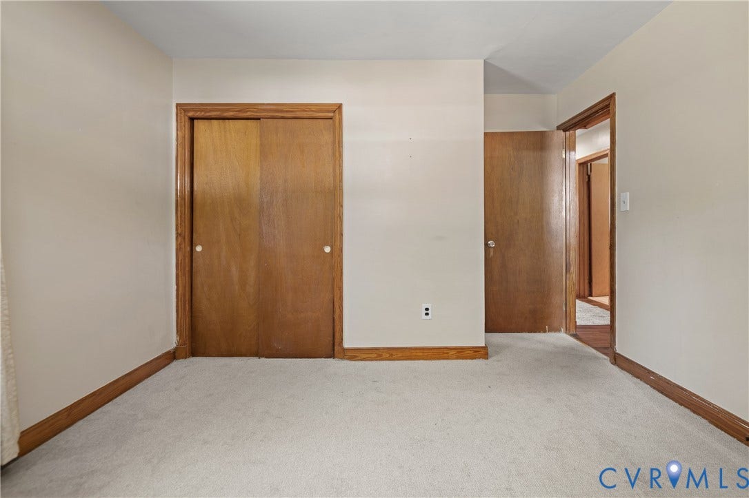 9834 N Wagstaff Circle, Mechanicsville, VA 23236 Neutral carpeting, wood-finish closet doors, and wood-finish door trim