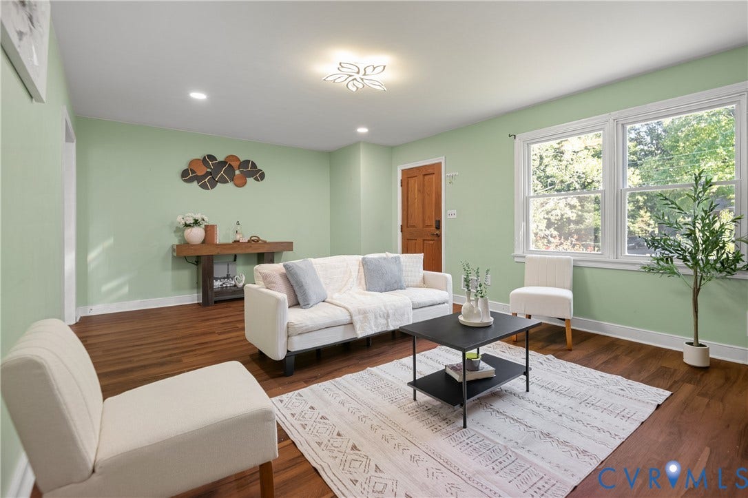 9834 N Wagstaff Circle, Mechanicsville, VA 23236 Living space featuring wood-finish flooring, double-hung windows, recessed lighting, and a multi-panel wood door