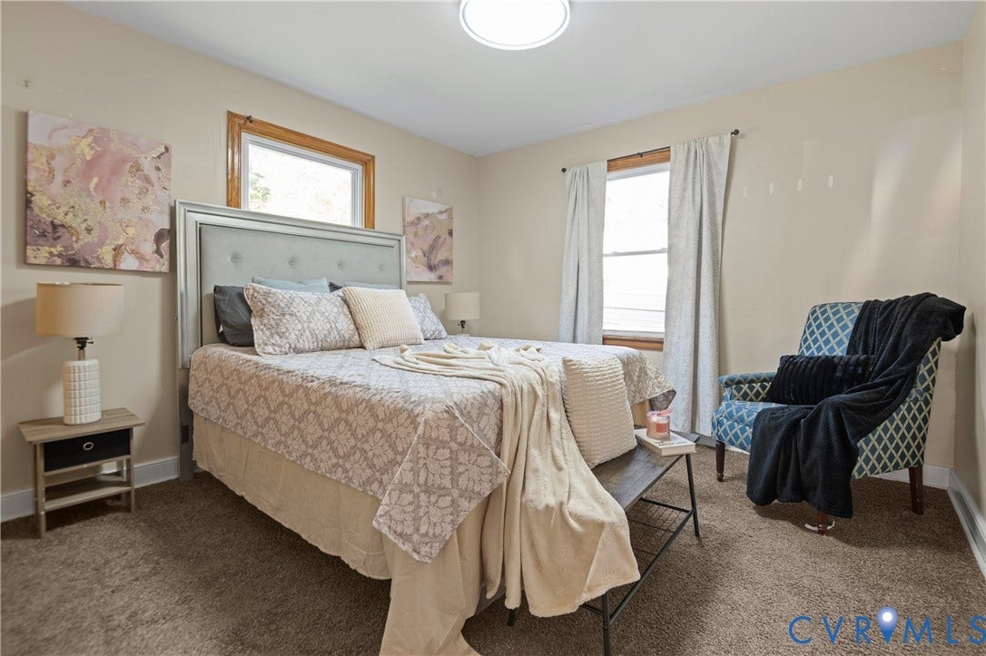 9834 N Wagstaff Circle, Mechanicsville, VA 23236 Neutral wall-to-wall carpeting, wood-frame windows, and a flush-mount circular ceiling light fixture
