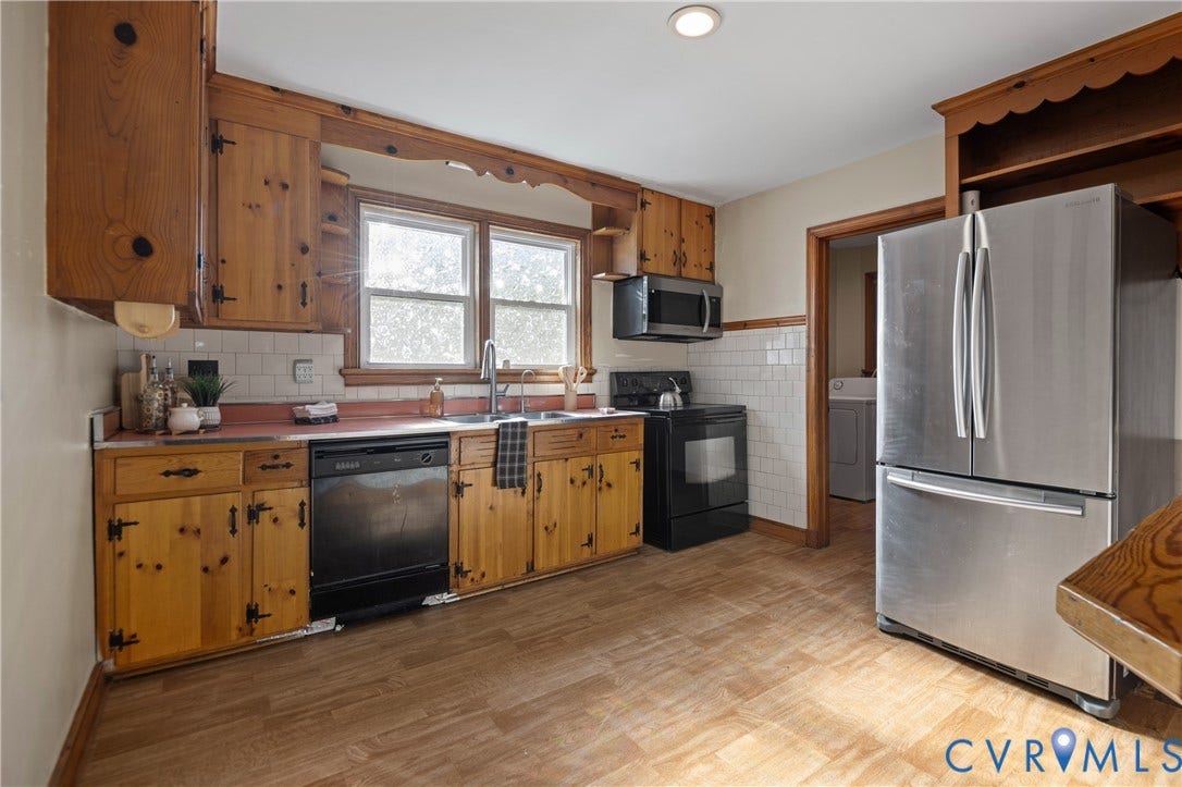 9834 N Wagstaff Circle, Mechanicsville, VA 23236 Kitchen featuring knotty pine cabinetry, white subway tile backsplash, stainless steel French-door refrigerator, and wood-finish flooring