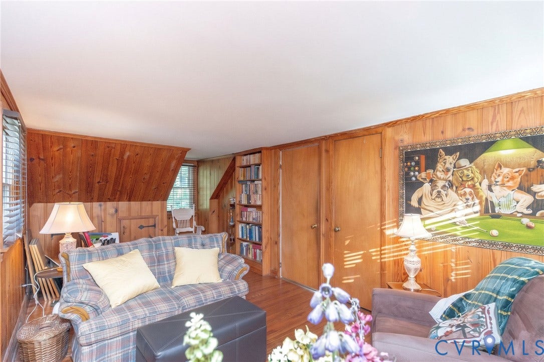 5211 W Grace Street, Richmond, VA 23226 Wood-paneled interior walls, built-in shelving, and wood-finish flooring