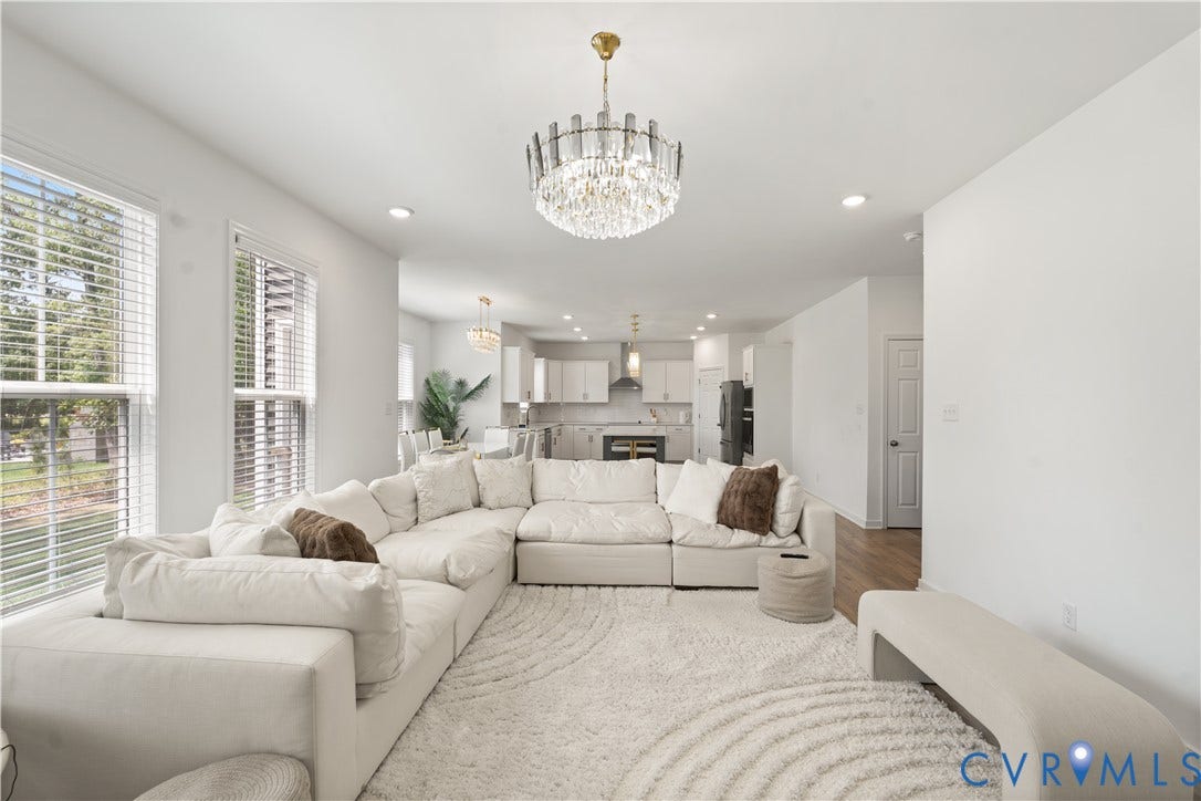 13807 Denleigh Court, Midlothian, VA 23112 Open-concept interior featuring crystal chandelier lighting, recessed ceiling lights, wood-finish flooring, and large windows with horizontal blinds