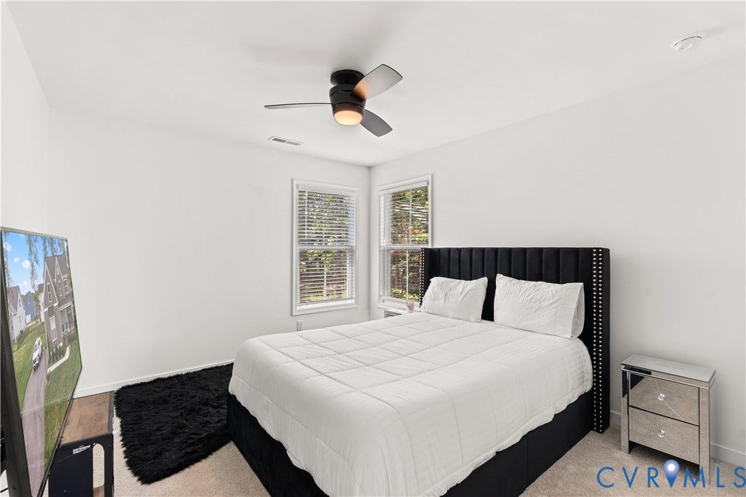 13807 Denleigh Court, Midlothian, VA 23112 Neutral-toned carpeted flooring, dual windows with horizontal blinds, and a modern ceiling fan with integrated lighting