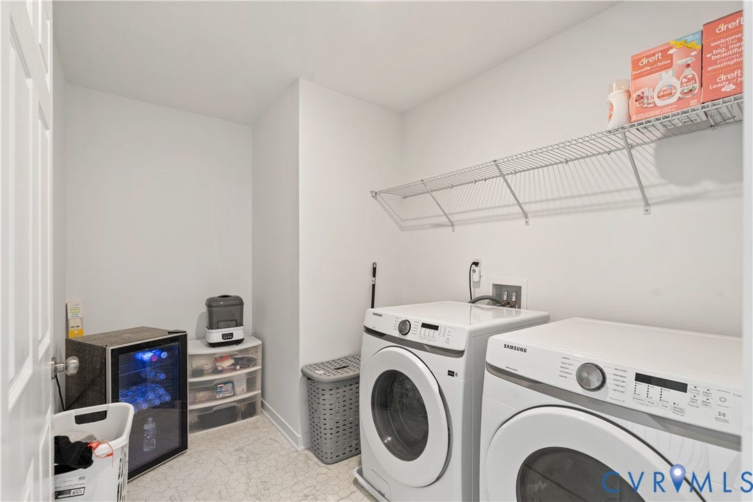 13807 Denleigh Court, Midlothian, VA 23112 Laundry area featuring white appliances, wall-mounted wire shelving, and neutral flooring