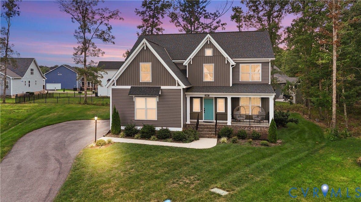 13807 Denleigh Court, Midlothian, VA 23112 Two-story exterior featuring vertical and horizontal siding, a covered front porch with a black metal railing, asphalt shingle roofing, and an asphalt driveway