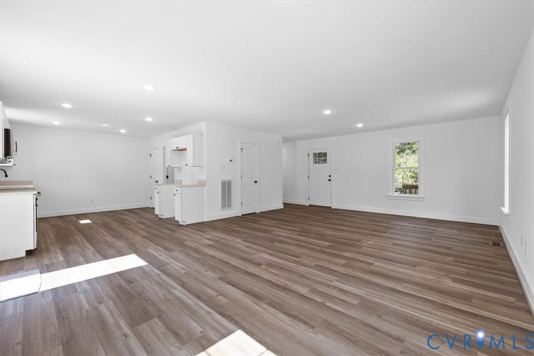 2242 Lakeview Drive, Powhatan, VA 23139 Open floor plan featuring wood-finish flooring, recessed lighting, and white cabinetry