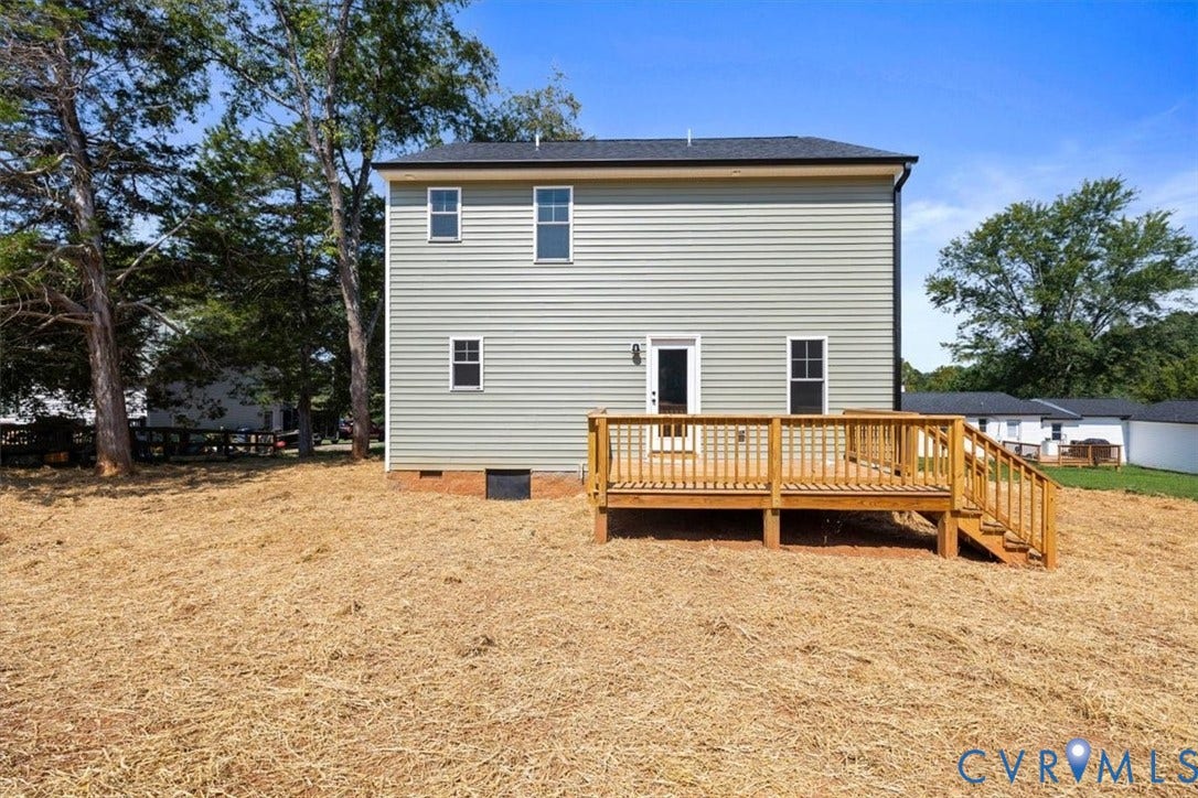 2242 Lakeview Drive, Powhatan, VA 23139 Two-story exterior featuring light-colored horizontal siding, a dark shingle roof, and a raised wooden deck with railings and staircase