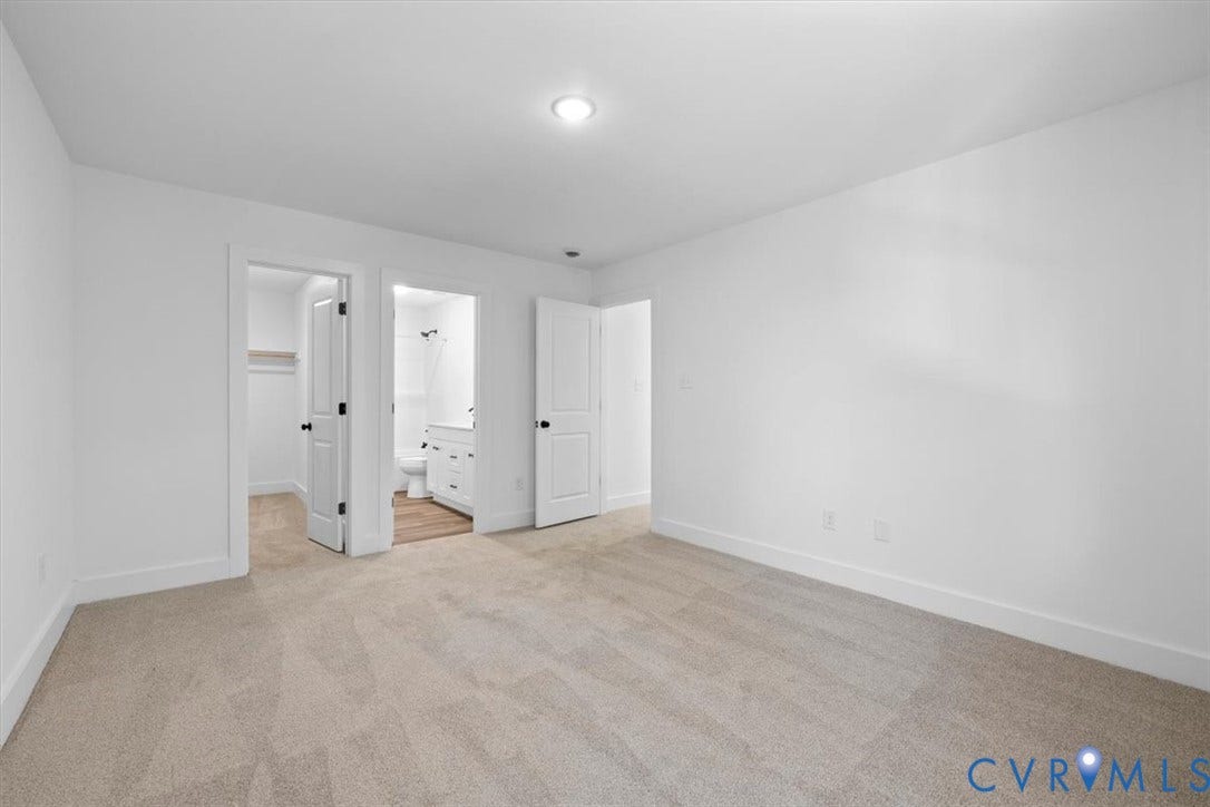 2242 Lakeview Drive, Powhatan, VA 23139 Neutral carpeting, recessed ceiling lighting, three-panel interior doors, and a reach-in closet featuring built-in shelving