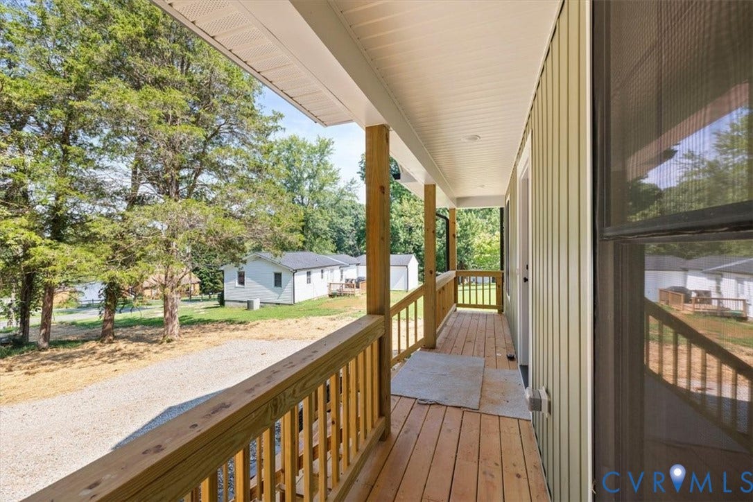 2242 Lakeview Drive, Powhatan, VA 23139 Covered porch featuring wood decking, wood railing, vertical siding, and recessed ceiling lighting