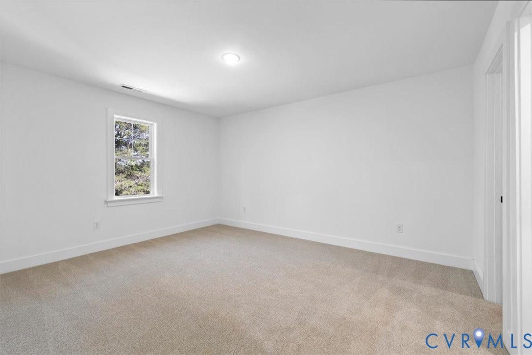 2242 Lakeview Drive, Powhatan, VA 23139 Neutral-toned carpeting, crisp white walls, and a single-hung window