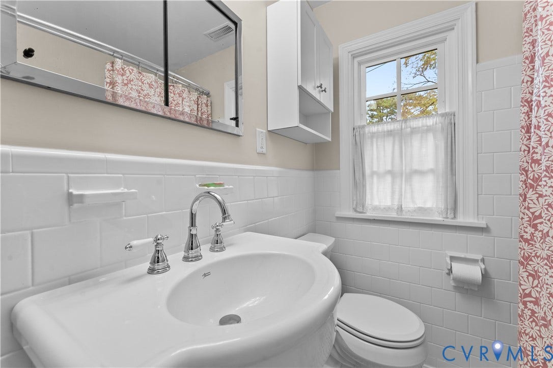 6956 Old Westham Road, Stratford Hills/Cherokee Road, Richmond, VA 23225 Wall-mounted medicine cabinet with mirror, pedestal sink with polished chrome widespread faucet, and white subway tile wall surround