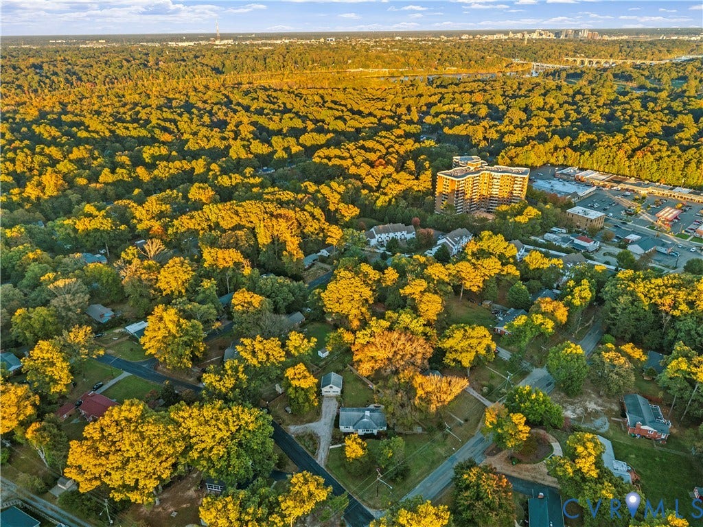 6956 Old Westham Road, Stratford Hills/Cherokee Road, Richmond, VA 23225 Aerial perspective of a wooded suburban area featuring mature deciduous trees and a distant cityscape horizon