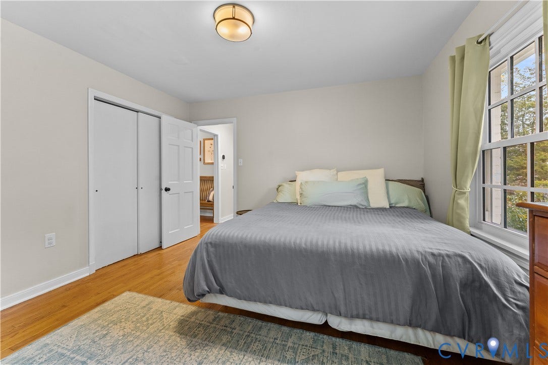 6956 Old Westham Road, Stratford Hills/Cherokee Road, Richmond, VA 23225 Wood-finish flooring, neutral wall tones, multi-pane window, flush-mount ceiling light, and double-door reach-in closet