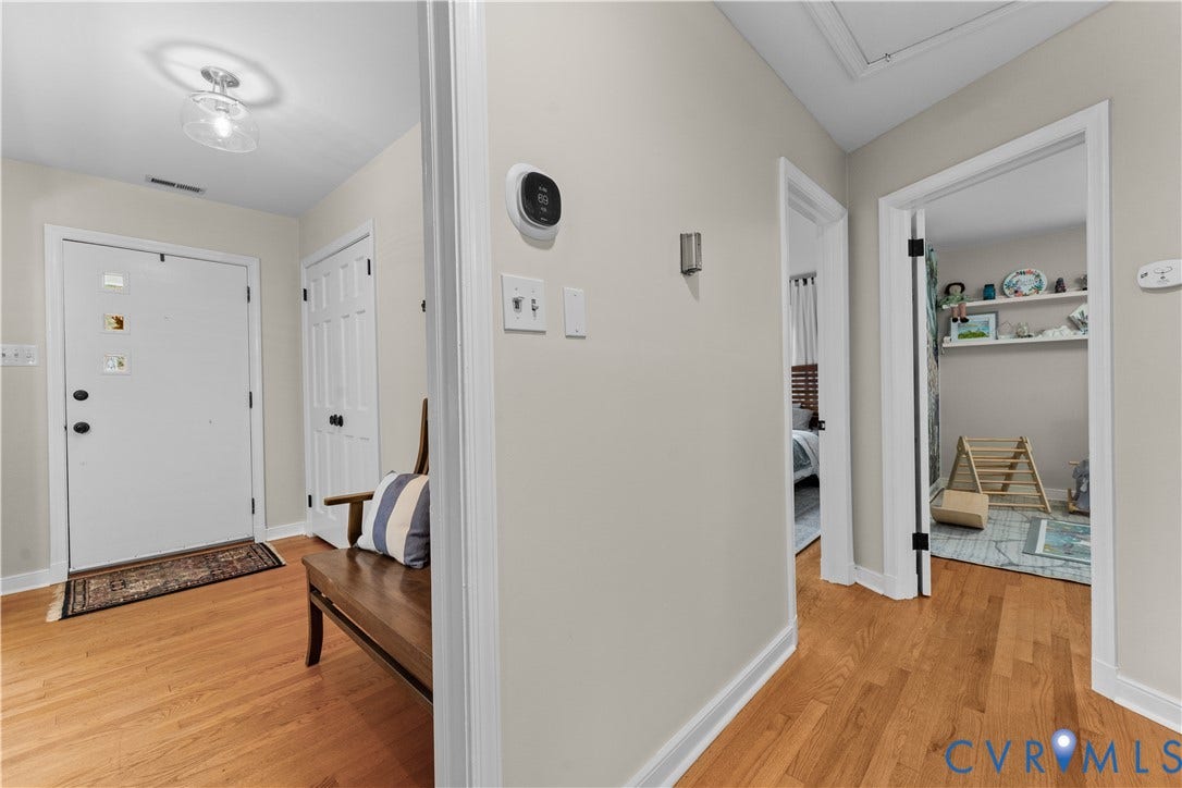 6956 Old Westham Road, Stratford Hills/Cherokee Road, Richmond, VA 23225 Entryway featuring wood-finish flooring, a flush-mount light fixture, and white interior doors with black hardware