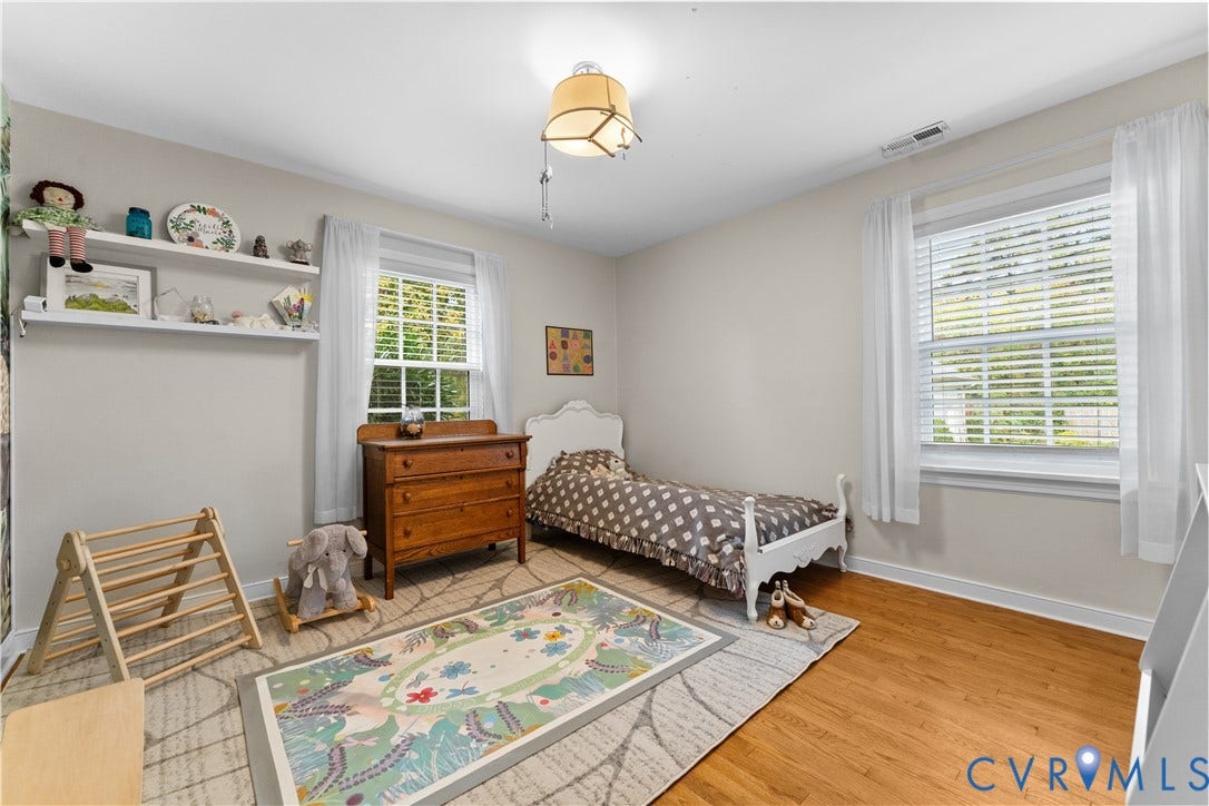 6956 Old Westham Road, Stratford Hills/Cherokee Road, Richmond, VA 23225 Bedroom featuring wood-finish flooring, dual windows with blinds, and built-in wall shelving
