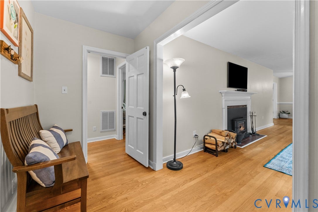 6956 Old Westham Road, Stratford Hills/Cherokee Road, Richmond, VA 23225 Interior space featuring wood-finish flooring, a traditional fireplace with a white mantel, and a six-panel interior door