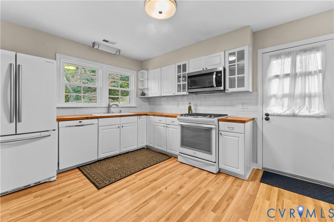 6956 Old Westham Road, Stratford Hills/Cherokee Road, Richmond, VA 23225 Kitchen featuring white shaker-style cabinetry, butcher block countertops, subway tile backsplash, white appliances, and wood-finish flooring