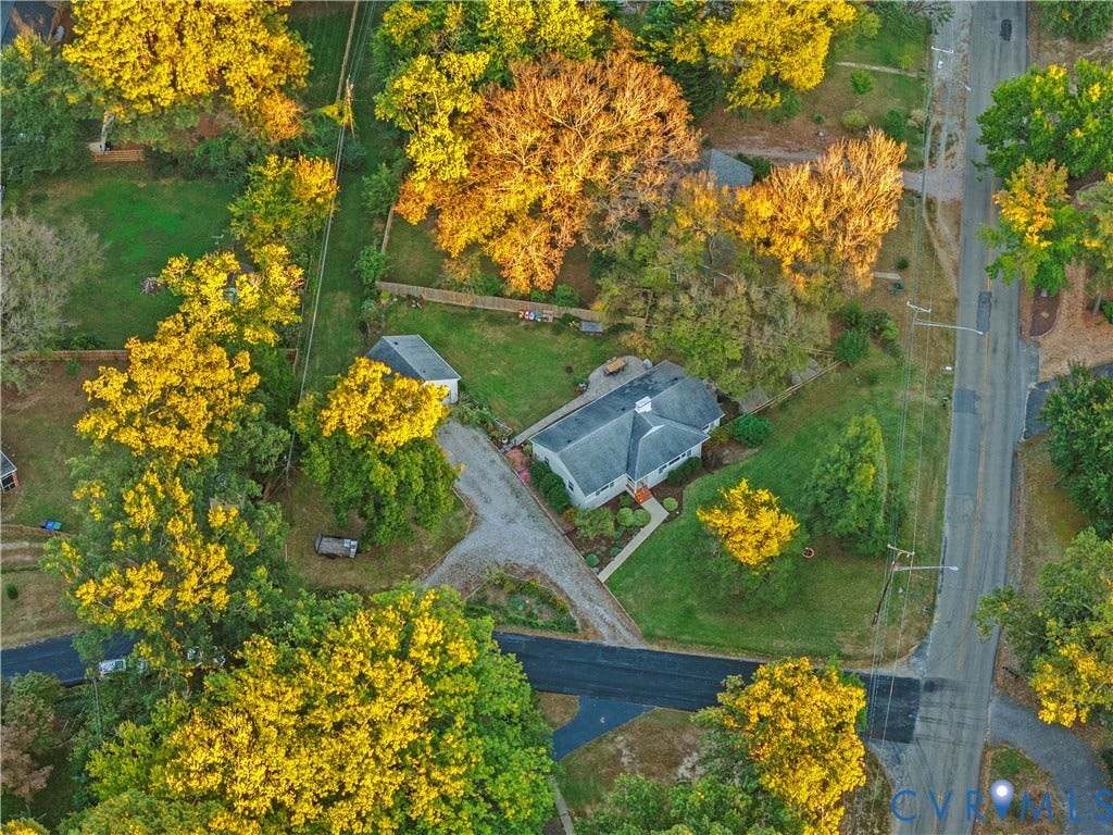 6956 Old Westham Road, Stratford Hills/Cherokee Road, Richmond, VA 23225 Aerial perspective of a detached residence featuring a multi-gabled roof, an expansive lot with mature tree canopy, a detached garage, and a winding driveway