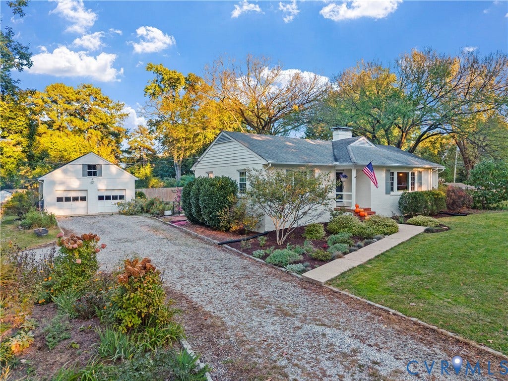 6956 Old Westham Road, Stratford Hills/Cherokee Road, Richmond, VA 23225 Single-story residence featuring light-colored siding, a detached two-car garage, an expansive gravel driveway, and mature landscaping