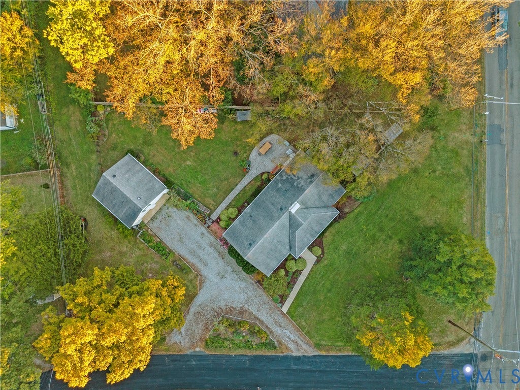 6956 Old Westham Road, Stratford Hills/Cherokee Road, Richmond, VA 23225 Aerial perspective of a property featuring a detached garage, expansive lawn, mature trees, gravel driveway, and paved patio area