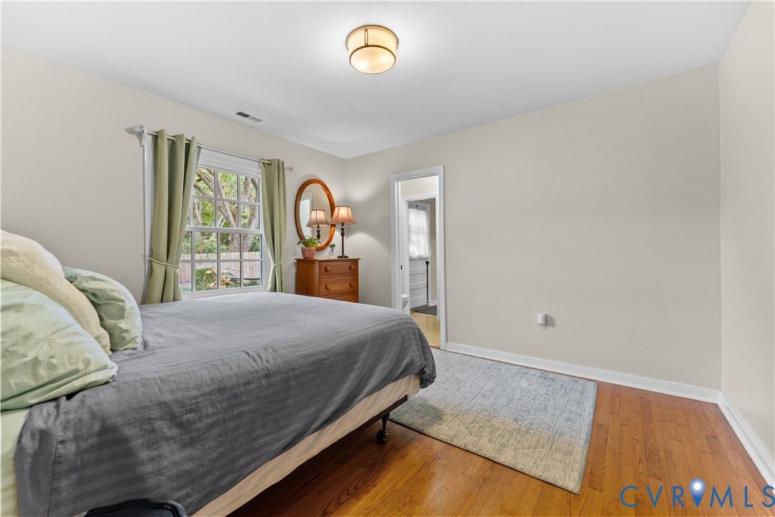 6956 Old Westham Road, Stratford Hills/Cherokee Road, Richmond, VA 23225 Room featuring wood-finish flooring, a neutral paint palette, a multi-pane window, and a semi-flush mount ceiling light fixture
